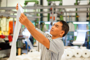 man inspecting poly bags